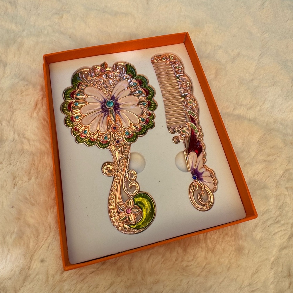Peacock mirror and comb set.